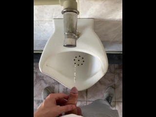 Guy pissing with big uncut cock in public toilet in slow motion POV