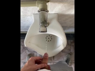 Guy pissing with big uncut cock in public toilet in slow motion POV