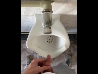 Guy pissing with big uncut cock in public toilet in slow motion POV