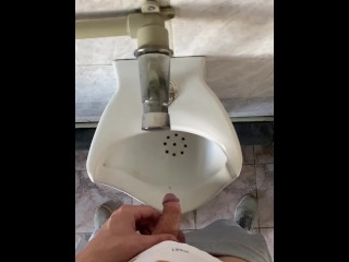 Guy pissing with big uncut cock in public toilet in slow motion POV