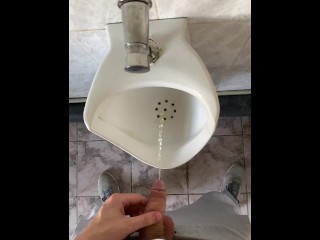 Guy pissing with big uncut cock in public toilet in slow motion POV