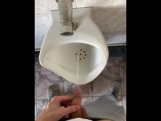 Guy pissing with big uncut cock in public toilet in slow motion POV