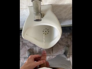 Guy pissing with big uncut cock in public toilet in slow motion POV