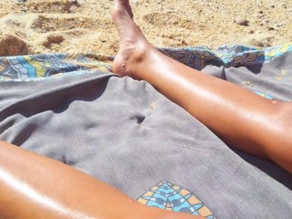 Sexy guy masturbates his cock looking at his girlfriend's pussy - she loves to be licked on beach