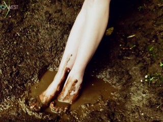 Muddy little feet in a mud puddle