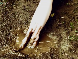 Muddy little feet in a mud puddle