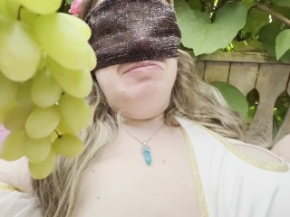 The Goddess is eating grapes and showing her tits on the terrace