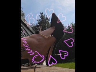 Clapping and dangling my hight heels in the sun.