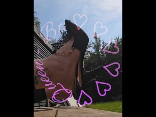 Clapping and dangling my hight heels in the sun.