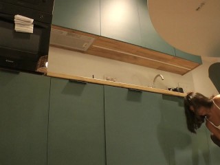 Panties Flash of a Cute Sexy Housewife on High Heels and Stockings in a Mini Short Skirt