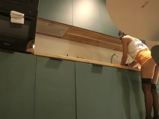 Panties Flash of a Cute Sexy Housewife on High Heels and Stockings in a Mini Short Skirt