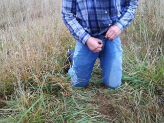 Rubber boots farmer pee in his pissy pants and plays with his cock on the meadow