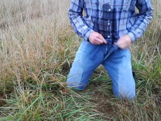 Rubber boots farmer pee in his pissy pants and plays with his cock on the meadow