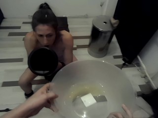 The slave drinks stinky yellow piss from the funnel in ego view