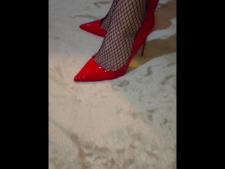 Gorgeous feet in red high heels and fishnets get recorded