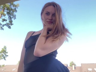 The pretty girl shows off her new black dress.