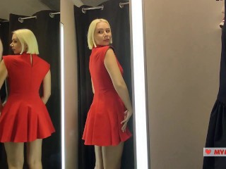 Naked girl with a big tits in the public locker room, try on transparent clothes