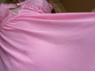 Pretty girl shows off her pink nightie.