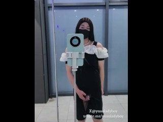 Chinese ladyboy in black tight skirt cums at the door of public toilet