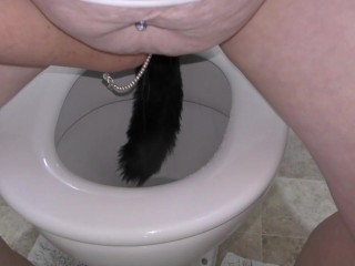 Trashy Kiwi MILF retrieves and reinserts Butt Plug tail after it falls out while pissing in toilet