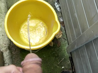 Huge outdoor piss into an orange bucket, POV. Felt so good to relieve myself al fresco.