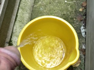 Huge outdoor piss into an orange bucket, POV. Felt so good to relieve myself al fresco.