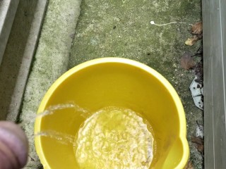 Huge outdoor piss into an orange bucket, POV. Felt so good to relieve myself al fresco.