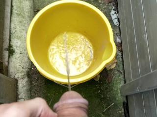 Huge outdoor piss into an orange bucket, POV. Felt so good to relieve myself al fresco.