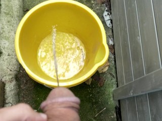 Huge outdoor piss into an orange bucket, POV. Felt so good to relieve myself al fresco.