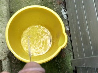 Huge outdoor piss into an orange bucket, POV. Felt so good to relieve myself al fresco.