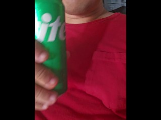 Man enjoying a sprite, licking and smacking lips