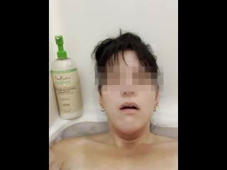 Girl masturbates in bathtub with her fingers and brings herself to orgasm