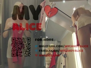 Bottom view in public fitting room on pussy of blonde with big tits