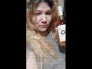 Cute and sexy girl drinks peanut butter screwball. Drink with me