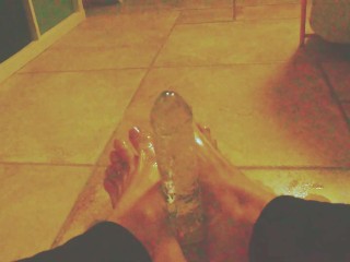 Ariel Ortiz gives a good footjob to her largest transparent dildo