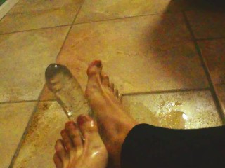 Ariel Ortiz gives a good footjob to her largest transparent dildo