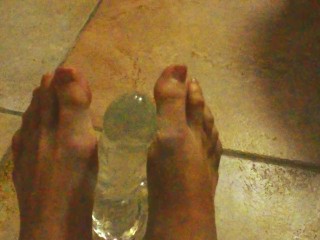 Ariel Ortiz gives a good footjob to her largest transparent dildo