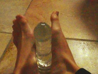 Ariel Ortiz gives a good footjob to her largest transparent dildo