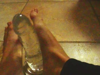 Ariel Ortiz gives a good footjob to her largest transparent dildo