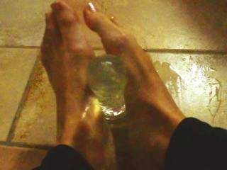 Ariel Ortiz gives a good footjob to her largest transparent dildo