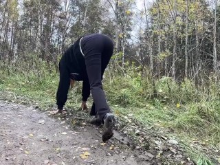 girl in high-heeled boots wants to go to home, but there is dirty slippery slide on the way