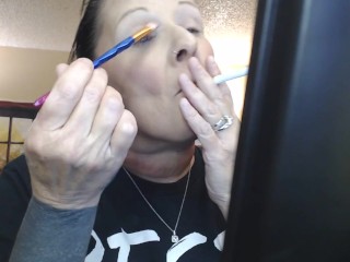 Doing Make up Dangling a Cigarette Cork Full Flavor