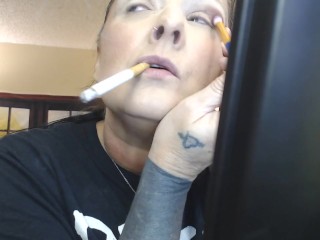 Doing Make up Dangling a Cigarette Cork Full Flavor