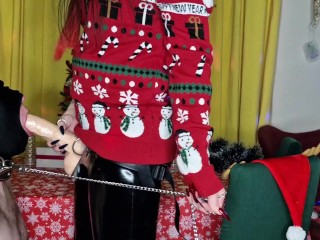 Dominatrix Nika congratulates her slave on Christmas with her big strap-on in his throat.