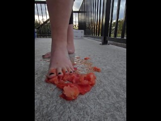 Squishing a juicy tomato with my bare feet, the juices squirted everywhere!