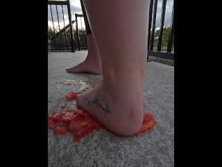 Squishing a juicy tomato with my bare feet, the juices squirted everywhere!