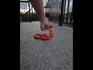 Squishing a juicy tomato with my bare feet, the juices squirted everywhere!