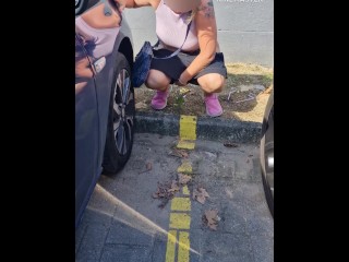 I was caught by a stranger while pissing between cars in the public parking lot
