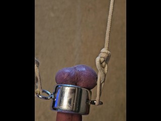 Holding 20 lbs with my balls, ordered by my Master.