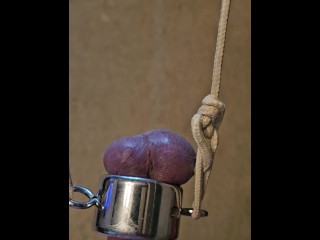 Holding 20 lbs with my balls, ordered by my Master.